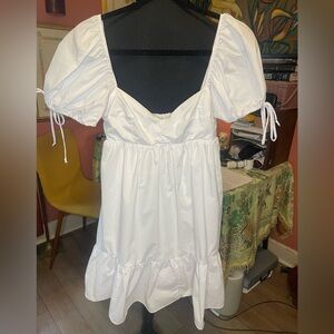 Olivaceous White Puff Sleeve Babydoll mini dress. Size medium. Retail $68.